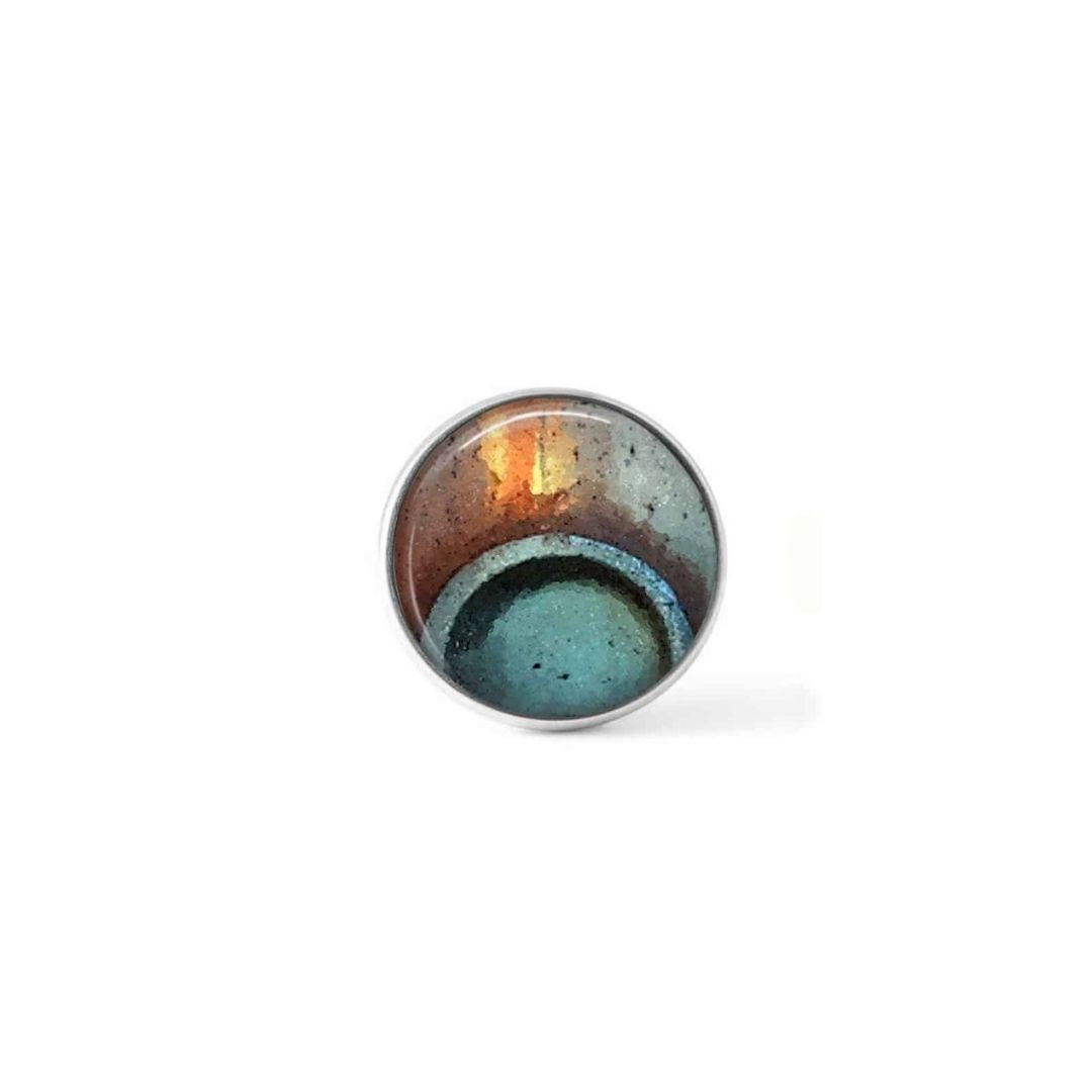 Bouton cabochon clipsable pour bijoux interchangeables avec un motif abstrait rond bleu turquoise et rouille