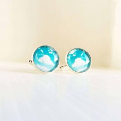 Cuff links with a blue sky and fluffy cloud theme