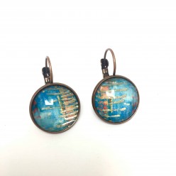 Boucles d'oreilles pendantes avec perle présentant un thème abstrait turquoise et feuille d'or