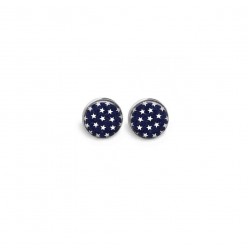 Stud earrings featuring a white star on a blue jean background
