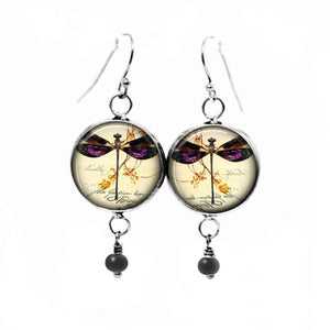 Fancy dangling earrings with vintage dragonfly theme.