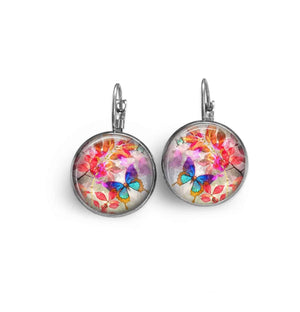 Leverback earrings with the Summertime theme Turquoise butterfly on a background of red leaves.