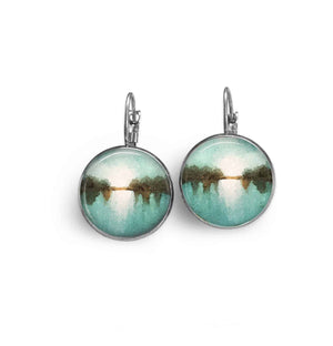 Leverback earrings with an abstract blue, white and brown “landscape” pattern