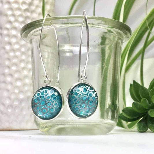 Boucles d'oreilles pendantes cercles argents et aquarelle turquoise