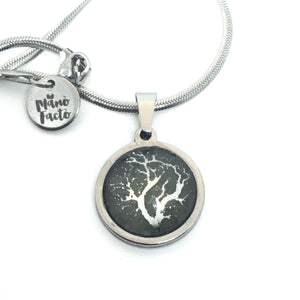 Silver or gold stainless steel necklace with tree of life theme on sage green background