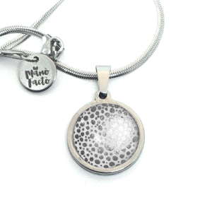 Stainless steel necklace with a silver polka dot theme