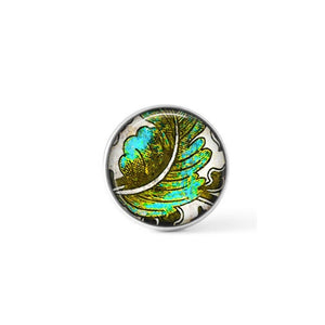 Interchangeable turquoise and khaki leaf themed snap button